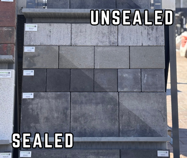 Display board from our yard showing the difference between sealed and unsealed pavers. 